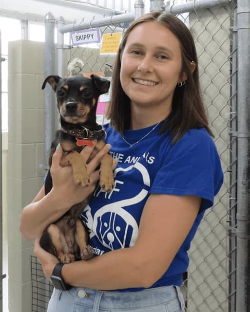 Jaclyn Lynch holding a dog